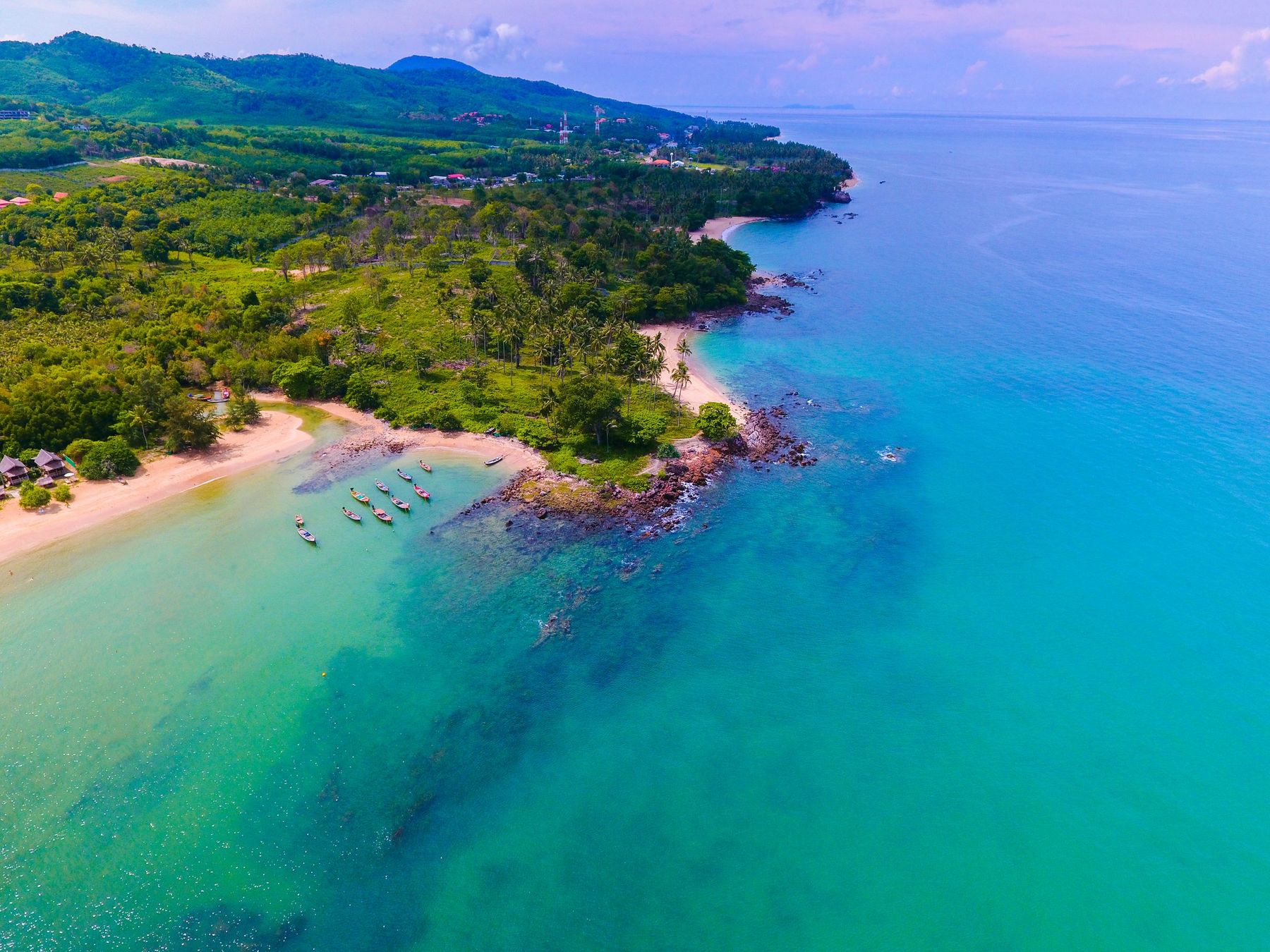 Aerial view of a beach and green hills on Koh Lanta